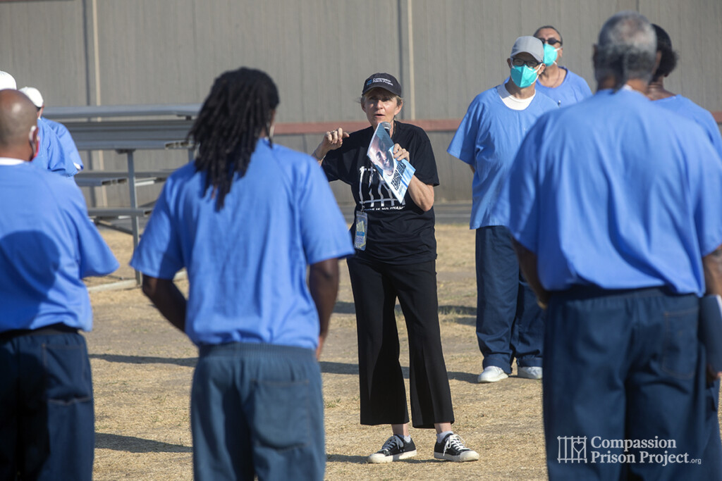 Fritzi in the middle of a circle of men